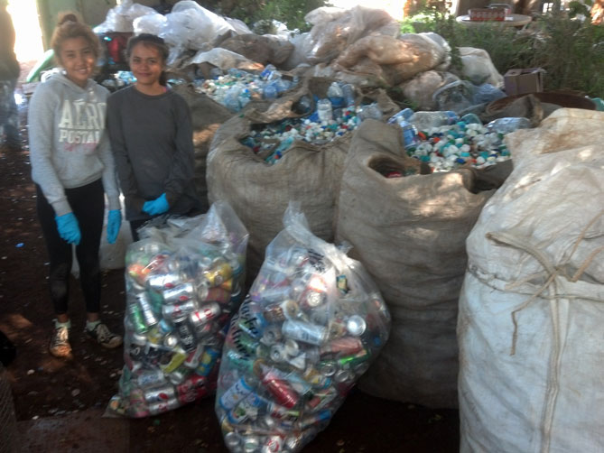 Worker girls with their sorted recyclables